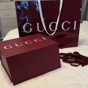 Gucci Deep Red Gift Set shopping bag and box will fit a bag.